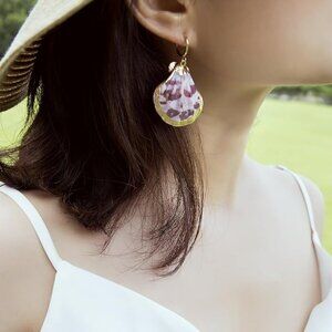 Gold sea shell pendant earrings